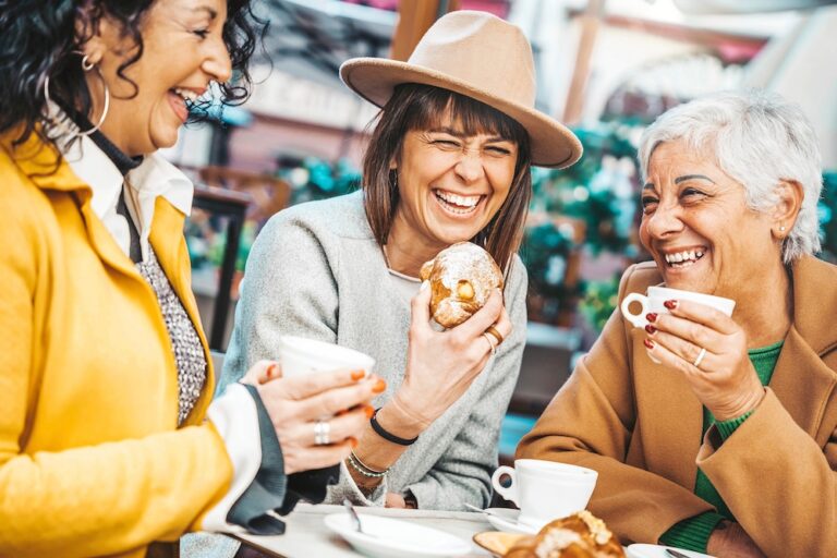 Three senior women enjoying coffee and breakfast together