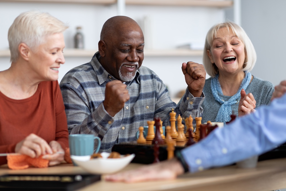 A group of senior friends play chess and other board games together