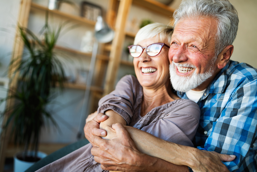 Couple embracing in senior living communities Omaha, NE.