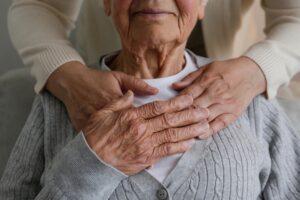 Senior and caregiver embrace in short term stay omaha.